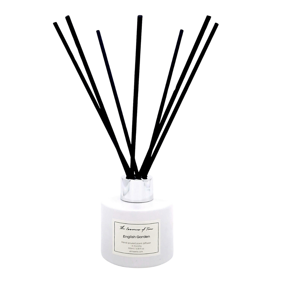 English Garden reed diffuser in a white jar with silver lid and black fibre reeds.