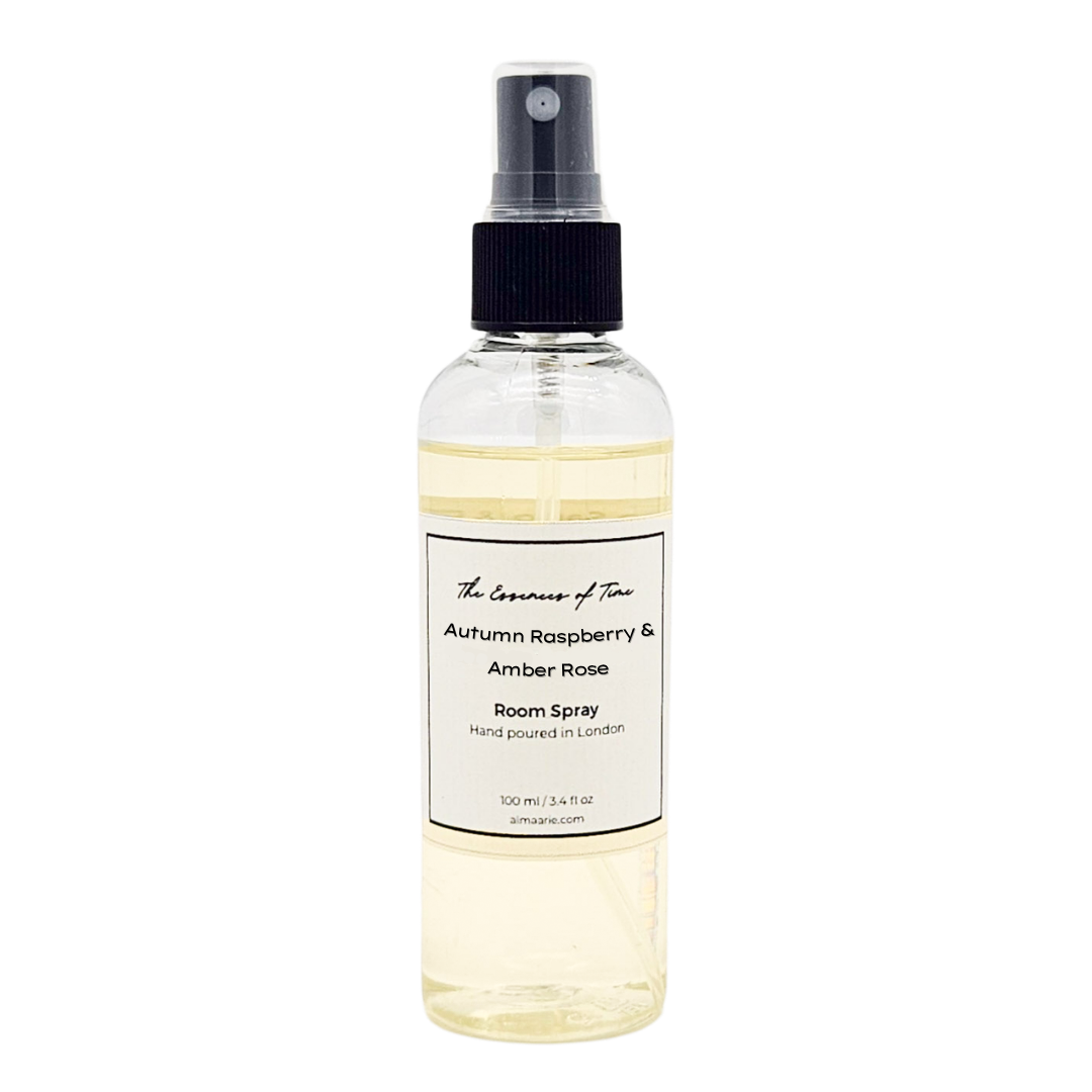 Autumn Raspberry and Amber Rose scented room spray in a clear bottle with black writing.