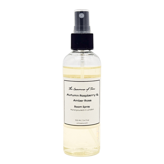 Autumn Raspberry and Amber Rose scented room spray in a clear bottle with black writing.