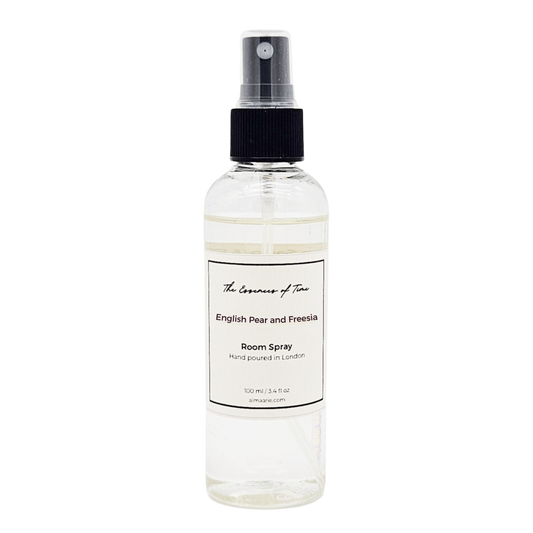 English Pear and Freesia scented room spray in a clear PET plastic bottle with black writing.