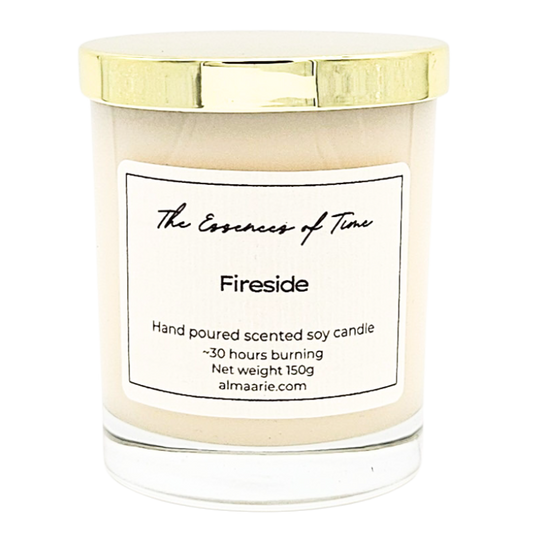 Fireside scented soya candle in an elegant and clear glass vessel with gold lid.