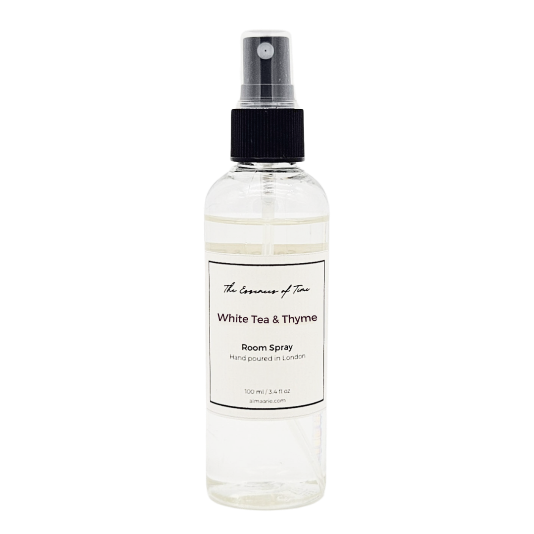 Clear room spray bottle labeled 'White Tea & Thyme' on a white background